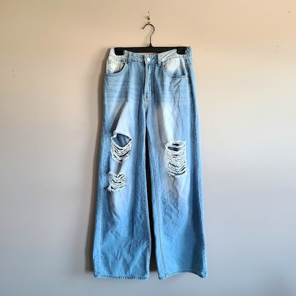 Denim - High waisted wide leg ripped blue jeans.